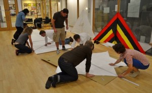 Copying out the blueprint of the DIY delta kite onto sheets of Tyvek